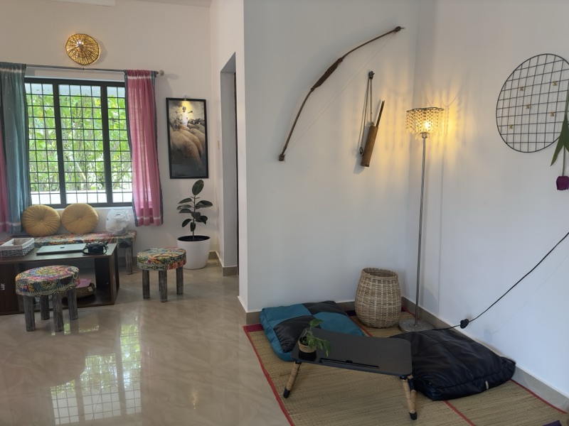 Verdant Kerala landscape surrounding Yellow Postbox