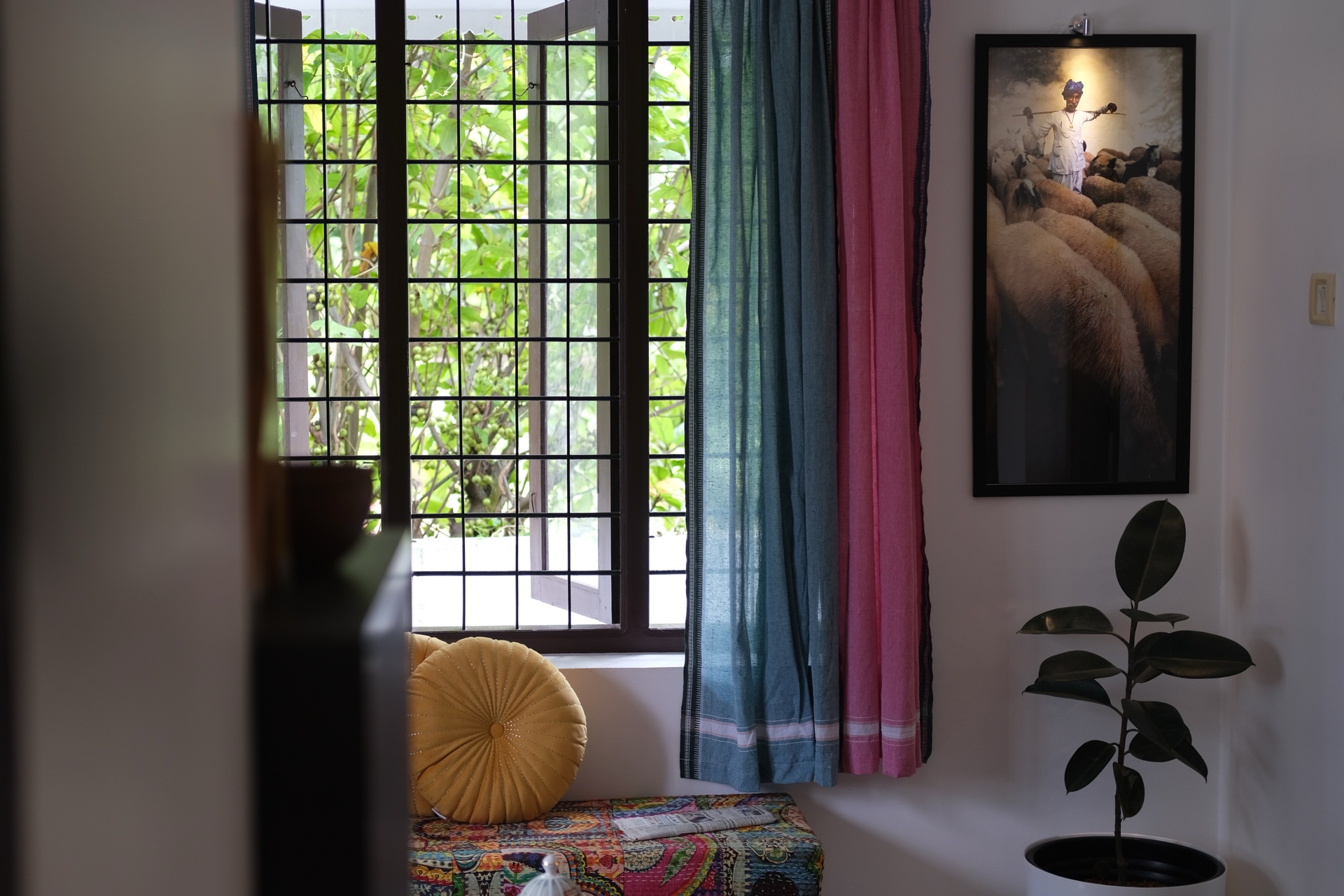 Peaceful exterior of Yellow Postbox nestled in Kerala greenery